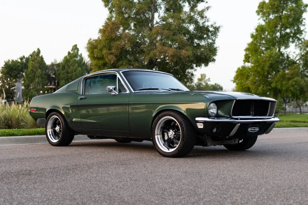 1968 Revology Mustang GT Fastback shown from a front three-quarter exterior view.