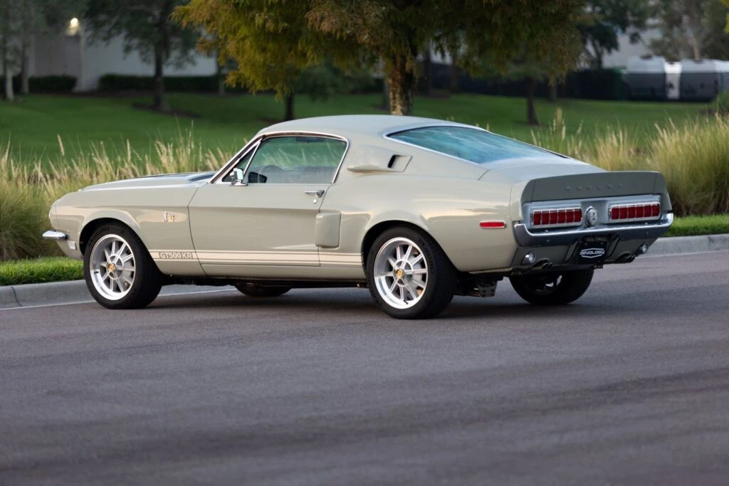 Rear side view of a 1968 Shelby GT500KR parked along the road